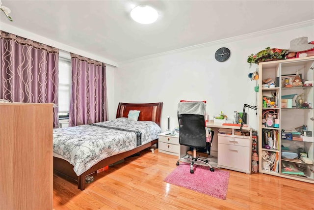 141-15 28th Ave Unit 1G, Flushing, NY 11354 - bedroom featuring crown molding, wood finished floors, and a desk