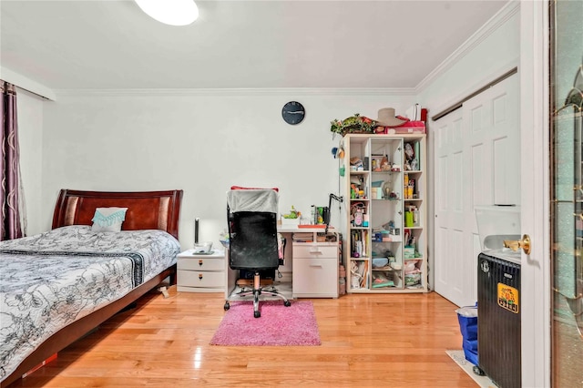 141-15 28th Ave Unit 1G, Flushing, NY 11354 - bedroom with crown molding, wood finished floors, a desk, and a closet