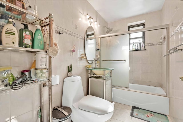 141-15 28th Ave Unit 1G, Flushing, NY 11354 - full bath featuring tile walls, combined bath / shower with glass door, vanity, and tile patterned flooring