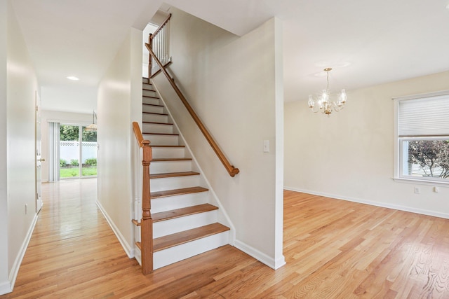 37 Baxter Rd, Pawling, NY 12564 - stairway with wood finished floors, a chandelier, and recessed lighting