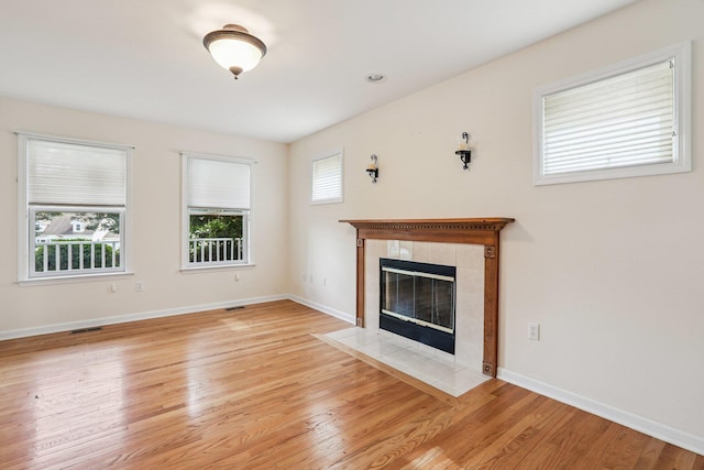 37 Baxter Rd, Pawling, NY 12564 - unfurnished living room featuring light wood-style floors and a tiled fireplace