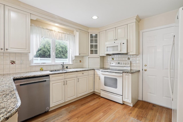 37 Baxter Rd, Pawling, NY 12564 - kitchen with white appliances, light wood-style floors, light stone counters, tasteful backsplash, and recessed lighting