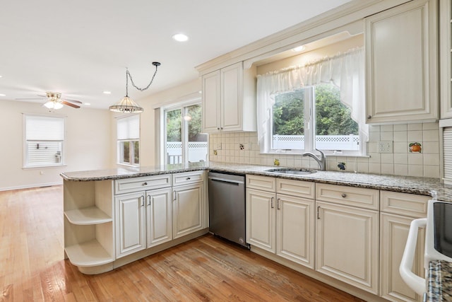 37 Baxter Rd, Pawling, NY 12564 - kitchen featuring stainless steel dishwasher, a peninsula, light wood finished floors, decorative backsplash, and ceiling fan