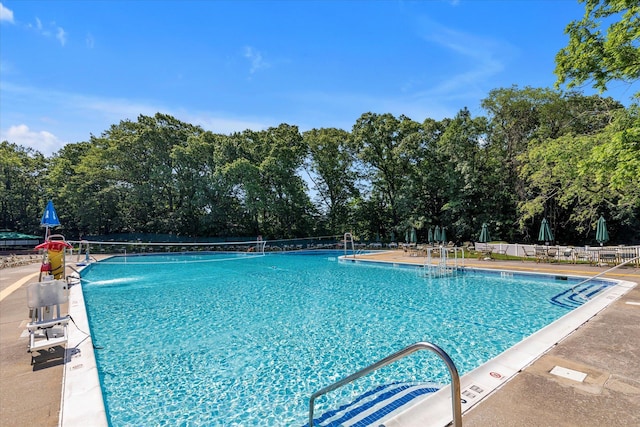 212-04 75th Ave Unit 4J, Bayside, NY 11364 - community pool featuring view of scattered trees and a patio area
