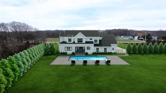 4935 Bergen Ave, Mattituck, NY 11952 - back of house featuring a patio and an outdoor pool