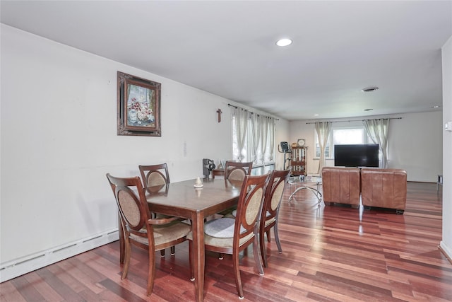 61 Buena Vista Rd, New City, NY 10956 - dining room with a baseboard heating unit, wood finished floors, and recessed lighting