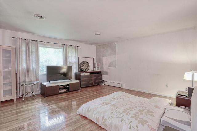 61 Buena Vista Rd, New City, NY 10956 - bedroom with wood finished floors and baseboard heating