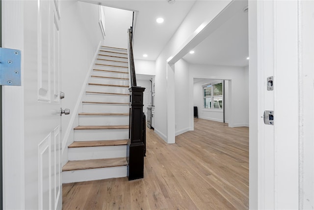 163 Grant Ave, Mineola, NY 11501 - staircase with wood finished floors and recessed lighting