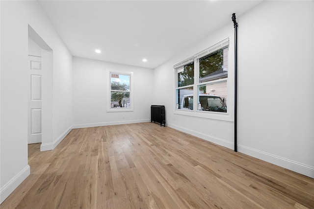 163 Grant Ave, Mineola, NY 11501 - unfurnished living room featuring light wood finished floors and recessed lighting