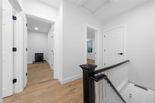 163 Grant Ave, Mineola, NY 11501 - corridor with radiator, an upstairs landing, light wood-style flooring, and recessed lighting