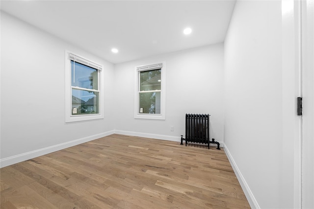 163 Grant Ave, Mineola, NY 11501 - unfurnished room with radiator, light wood finished floors, and recessed lighting