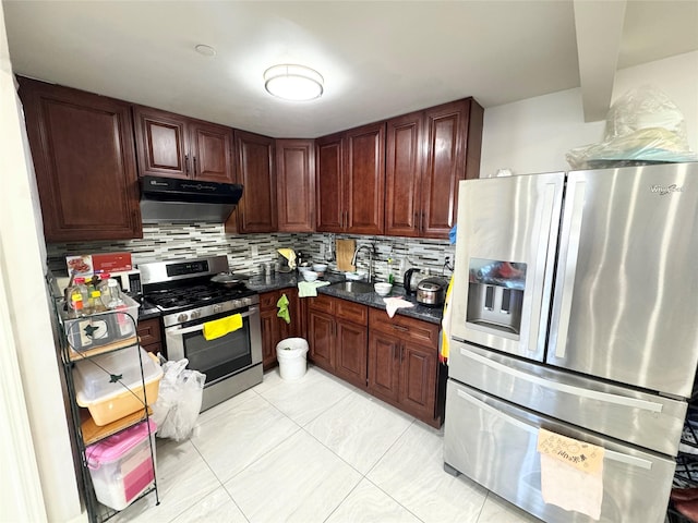 145-38 34th Ave Unit 2C, Flushing, NY 11435 - kitchen featuring stainless steel appliances, under cabinet range hood, dark countertops, and decorative backsplash