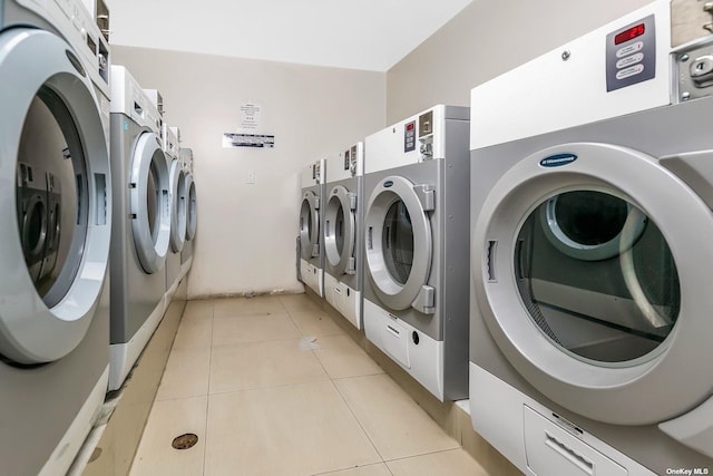 145-38 34th Ave Unit 2C, Flushing, NY 11435 - community laundry room with washing machine and dryer and light tile patterned floors