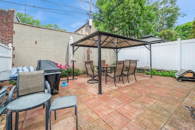 845 Kinsella St, Bronx, NY 10462 - fenced backyard with outdoor dining area, a patio, and a gazebo