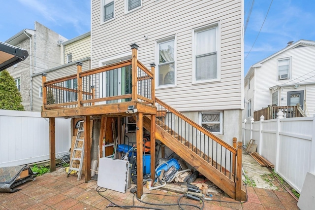 845 Kinsella St, Bronx, NY 10462 - rear view of house featuring stairs, a fenced backyard, a wooden deck, and a patio