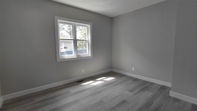 117-36 165th St, Jamaica, NY 11434 - empty room featuring dark wood finished floors and baseboards