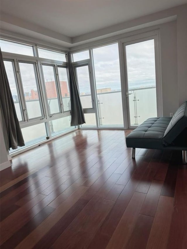 142-38 37th Ave Unit 8B, Flushing, NY 11368 - living area featuring plenty of natural light and dark wood-style floors