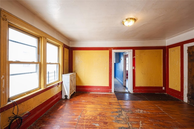 31-30 100th St, East Elmhurst, NY 11369 - spare room with dark wood-style floors and baseboards