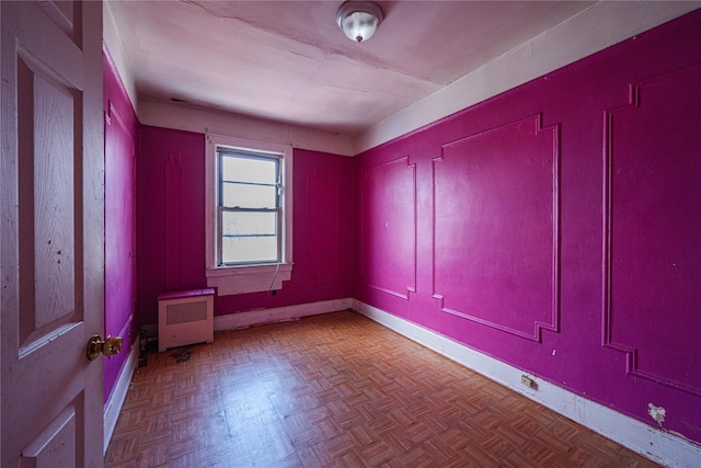 31-30 100th St, East Elmhurst, NY 11369 - empty room featuring radiator heating unit and baseboards