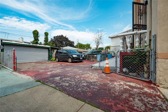 31-30 100th St, East Elmhurst, NY 11369 - view of parking / parking lot featuring a gate