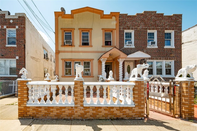 31-30 100th St, East Elmhurst, NY 11369 - view of front of home featuring stucco siding and a gate