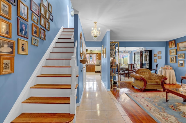 25-27 76th St, Jackson Heights, NY 11370 - stairway featuring a chandelier and tile patterned floors