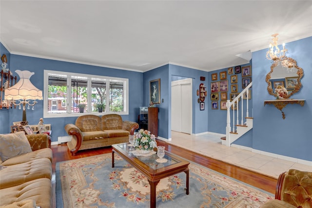 25-27 76th St, Jackson Heights, NY 11370 - living room with stairs, a chandelier, wood finished floors, and crown molding