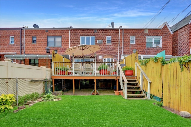 25-27 76th St, Jackson Heights, NY 11370 - back of house featuring brick siding and a wooden deck