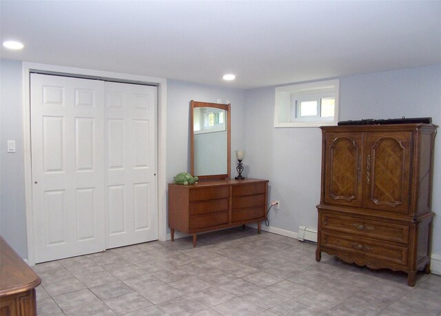 341 Thrift St, Ronkonkoma, NY 11779 - bedroom with a baseboard radiator, a closet, light tile patterned floors, and recessed lighting