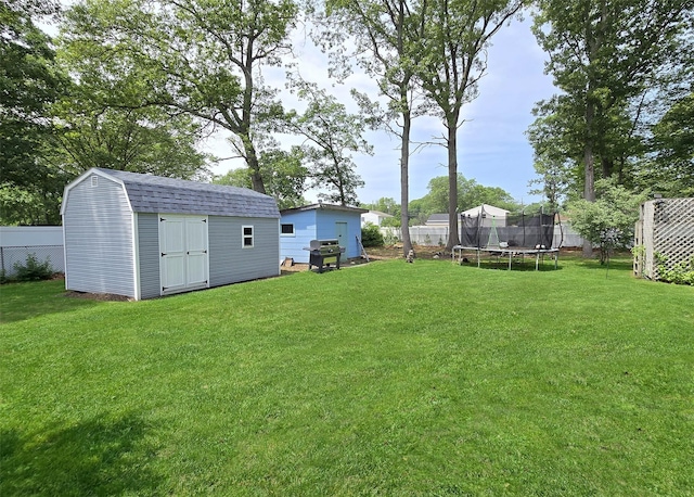 341 Thrift St, Ronkonkoma, NY 11779 - view of yard featuring a trampoline and a shed