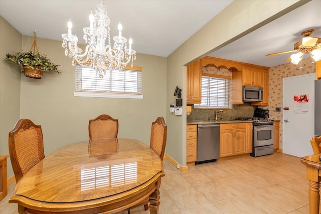 3454 201st St, Bayside, NY 11361 - dining space featuring a chandelier, light tile patterned floors, healthy amount of natural light, and a ceiling fan