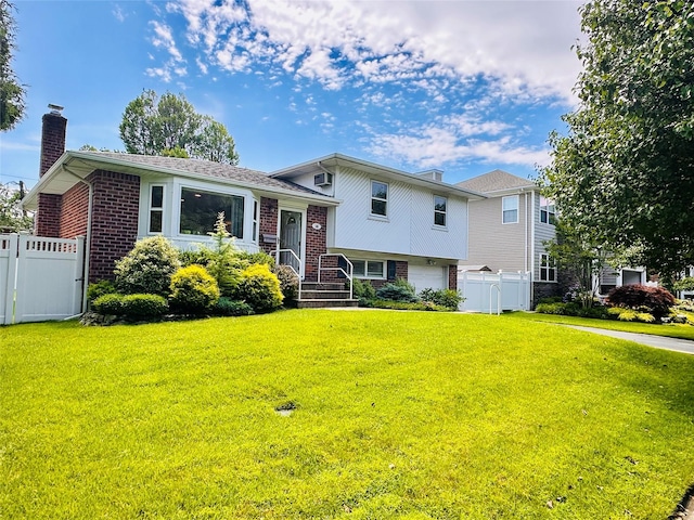 16 Warren Dr, Syosset, NY 11791 - tri-level home featuring brick siding, a chimney, and an attached garage