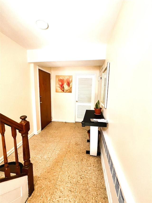 40-03 56th St, Woodside, NY 11377 - hall featuring a baseboard radiator and stairway