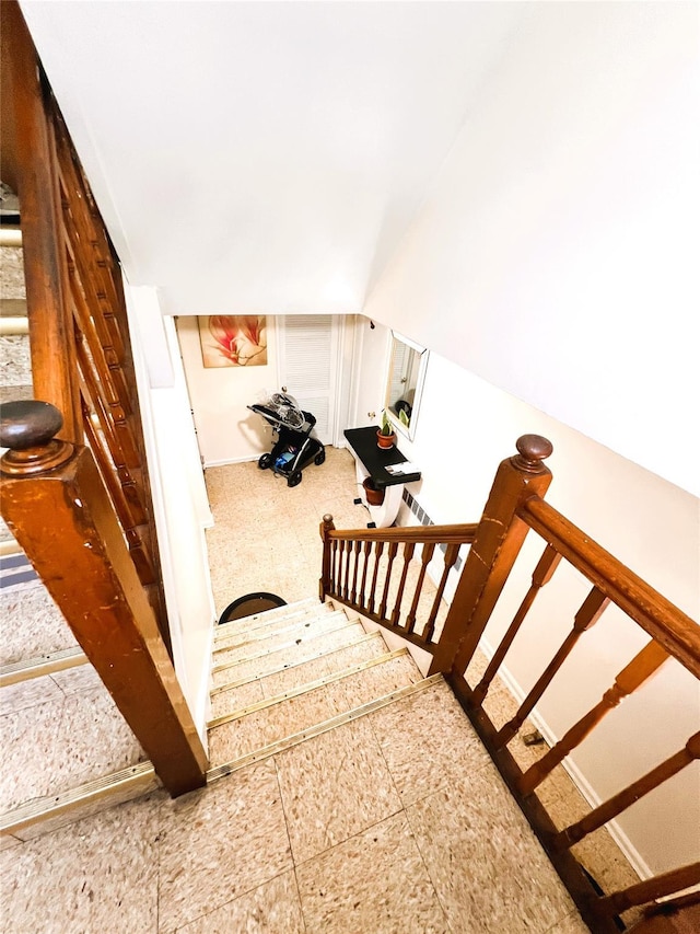 40-03 56th St, Woodside, NY 11377 - stairway featuring vaulted ceiling and baseboards