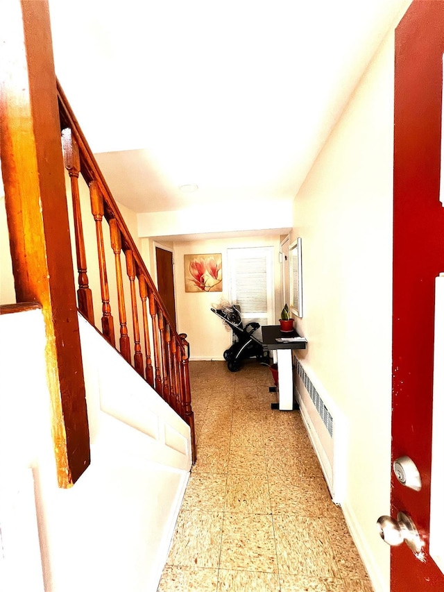 40-03 56th St, Woodside, NY 11377 - hall with stairway, tile patterned floors, and radiator