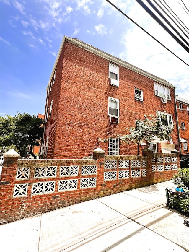 40-03 56th St, Woodside, NY 11377 - view of side of property with brick siding