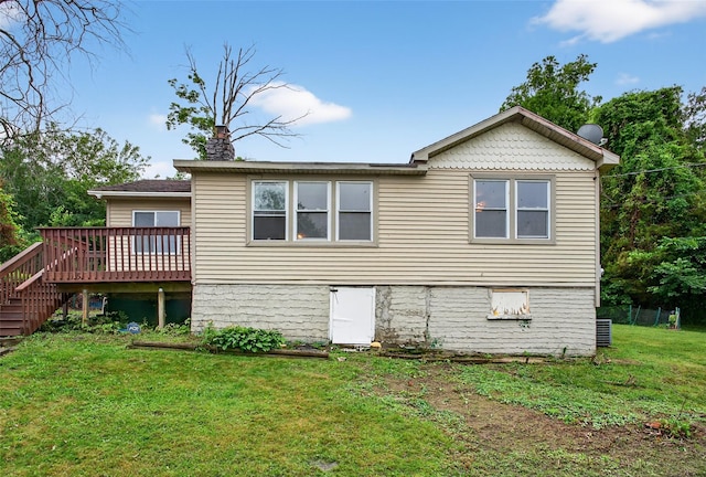 15 Claremont Trl, Monroe, NY 10950 - back of property with a lawn, a deck, stairs, and a chimney