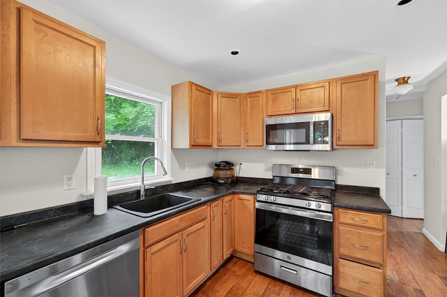15 Claremont Trl, Monroe, NY 10950 - kitchen featuring appliances with stainless steel finishes, dark countertops, and light wood-style floors