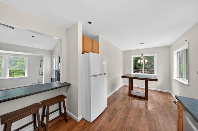 15 Claremont Trl, Monroe, NY 10950 - kitchen featuring freestanding refrigerator, dark countertops, healthy amount of natural light, and wood finished floors