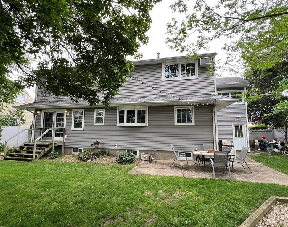 556 Alwick Ave, West Islip, NY 11795 - back of property featuring a patio