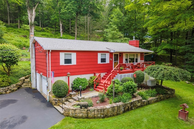 194 Bell Hollow Rd, Putnam Valley, NY 10579 - view of front of home featuring a chimney, asphalt driveway, stairs, an attached garage, and a shingled roof