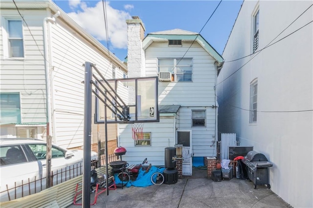 1664 W 8th St, Brooklyn, NY 11223 - rear view of property featuring a chimney