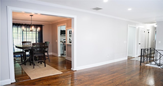 11 Boxwood Close, Hopewell Junction, NY 12533 - dining room with wood finished floors, a chandelier, and crown molding