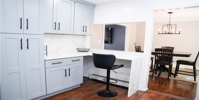 11 Boxwood Close, Hopewell Junction, NY 12533 - kitchen with a baseboard radiator, dark wood-style flooring, a chandelier, and light stone countertops