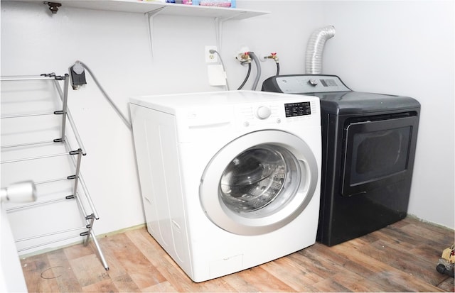 11 Boxwood Close, Hopewell Junction, NY 12533 - laundry room featuring washing machine and dryer and light wood finished floors