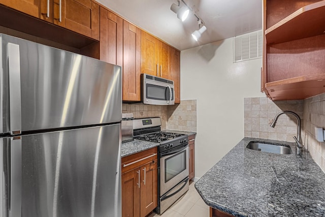 102-30 66th Rd Unit 5K, Forest Hills, NY 11375 - kitchen featuring appliances with stainless steel finishes, open shelves, backsplash, and dark stone countertops