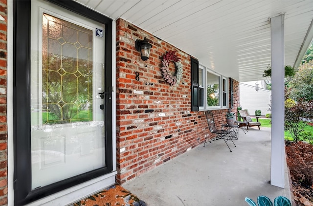 8 Argow Pl, Nanuet, NY 10954 - entrance to property featuring covered porch and brick siding