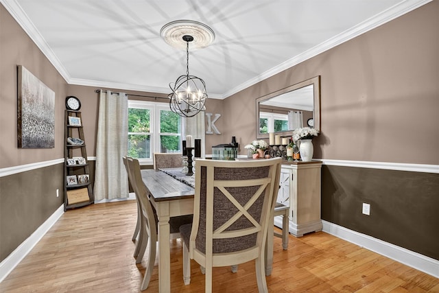 8 Argow Pl, Nanuet, NY 10954 - dining area with a chandelier, healthy amount of natural light, light wood-style flooring, and ornamental molding