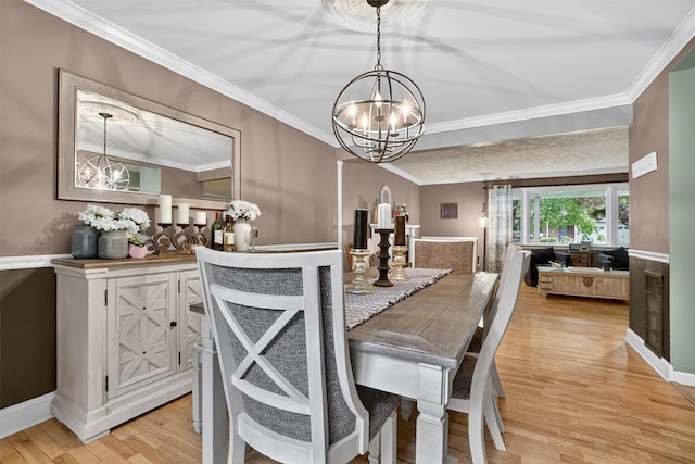 8 Argow Pl, Nanuet, NY 10954 - dining space featuring a chandelier, light wood finished floors, and ornamental molding