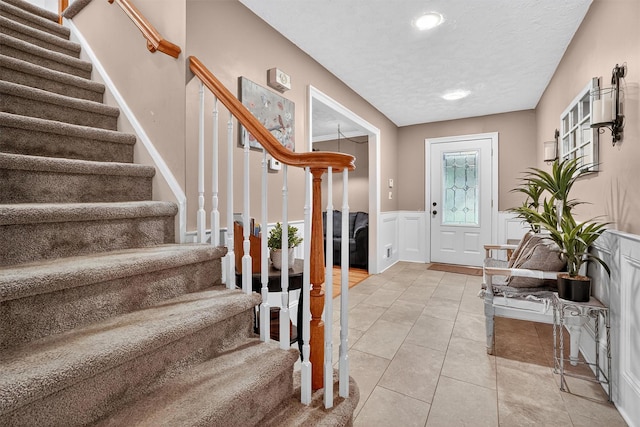 8 Argow Pl, Nanuet, NY 10954 - entrance foyer with stairway, a wainscoted wall, a textured ceiling, recessed lighting, and a decorative wall